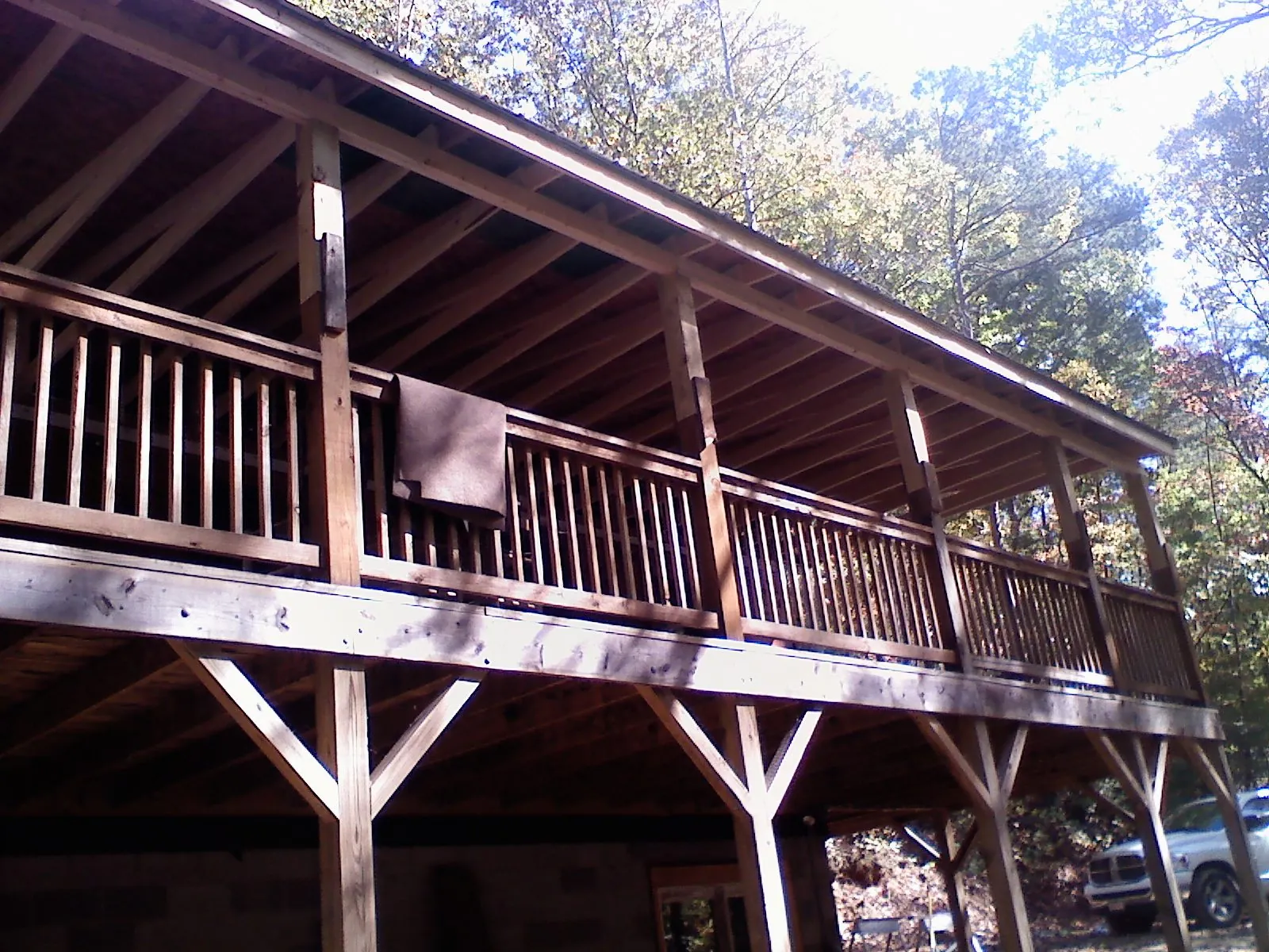 Timber framing under a new elevated porch and deck — Roof Leak Repair in Northwood by Roofing Brothers